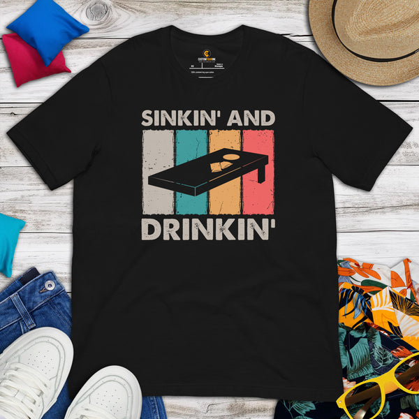 Cornhole T-Shirt - Corn Hole Bags & Board, Bean Bag Toss, Outdoor Yard & Backyard Party Games Gift - Retro Sinkin' And Drinkin' Tee - Black