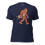 Adorable Bigfoot Carrying Ferret T-Shirt - Cryptid Legends Yeti, Sasquatch Tee for Weasel Mom & Dad, Wilderness Adventure Enthusiasts - Navy